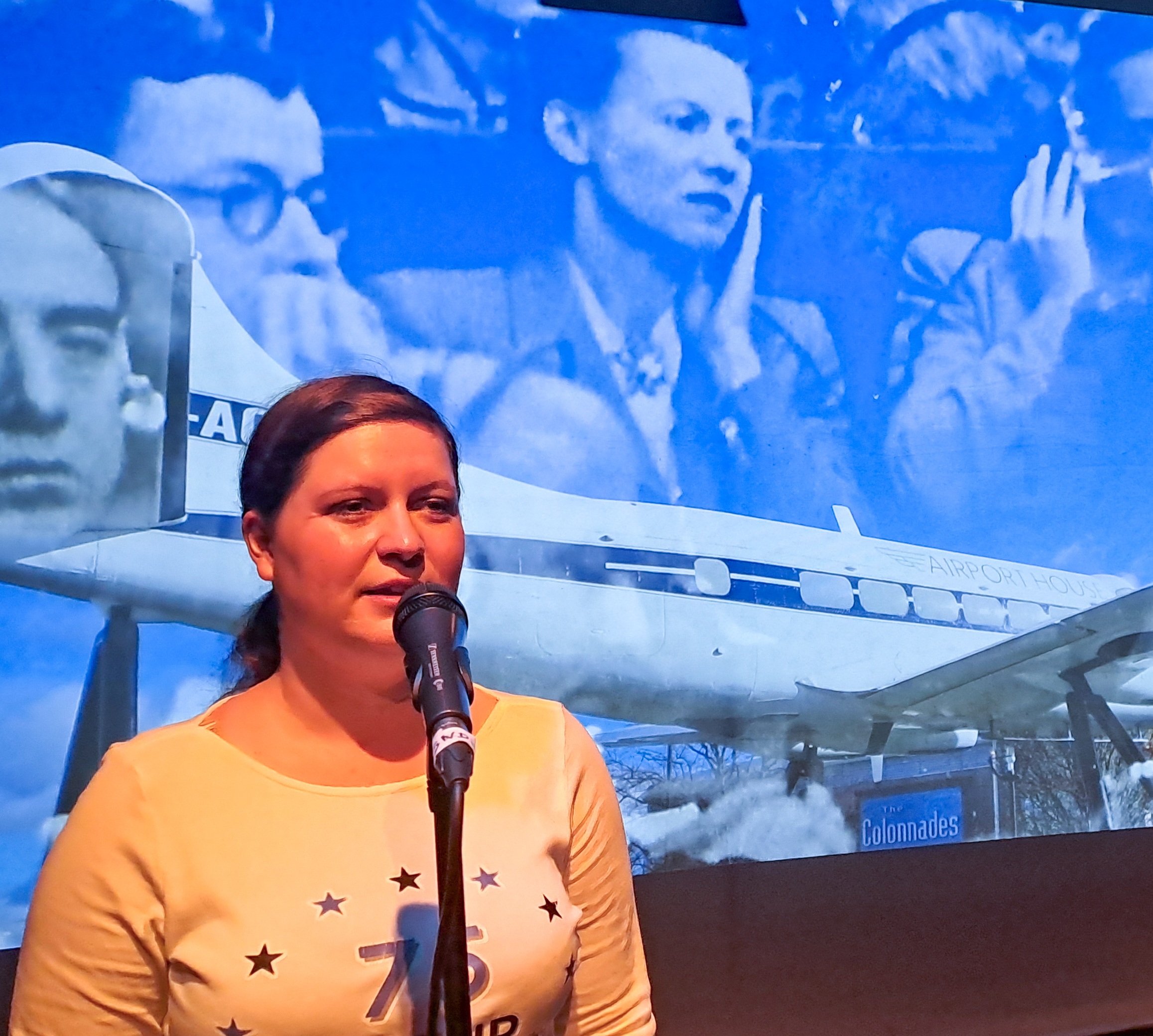 Actress in front of Nuremberg footage